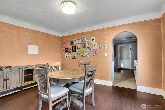 a view of a dining room with furniture and wooden floor