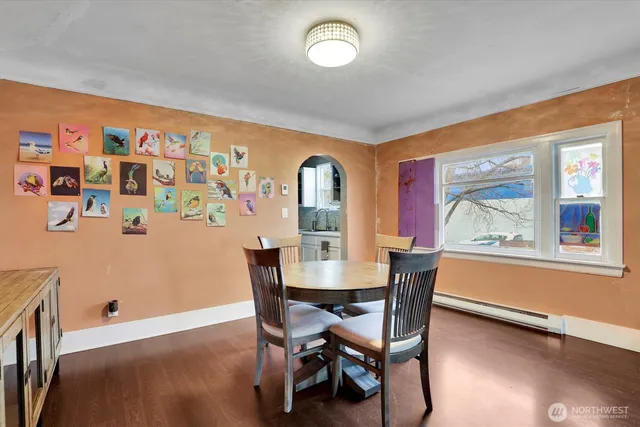 a view of a dining room with furniture window and wooden floor