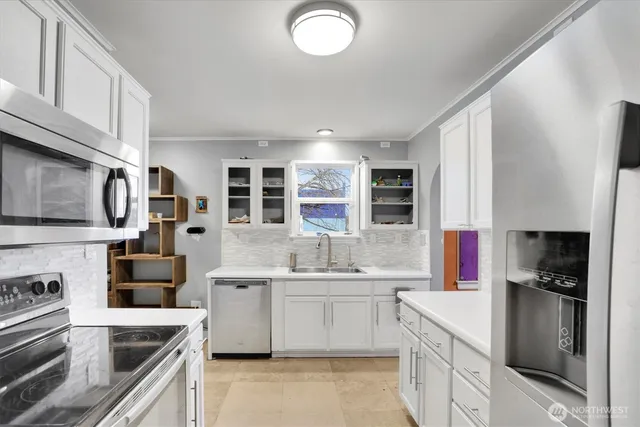 a kitchen with a sink stove and refrigerator