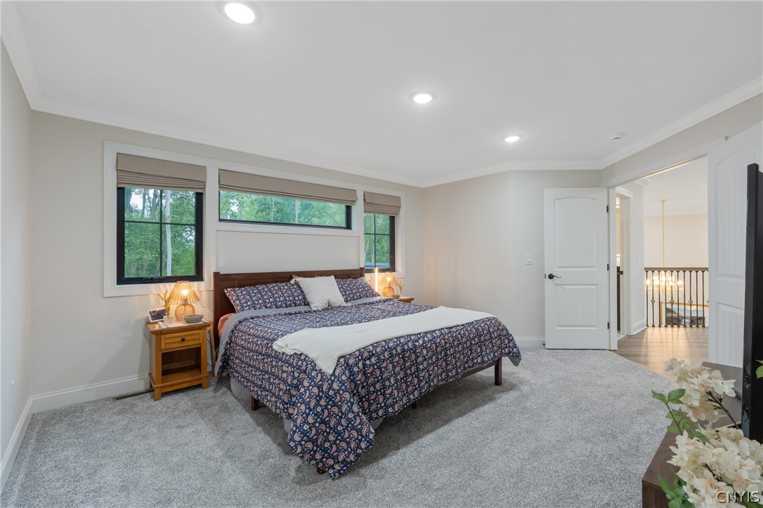 2020 Rubicon Road Lysander, NY 13027 - Photo 29 of 49 Swing open the double doors to the tranquil owners suite with custom shades, plush carpet, & recessed lighting.