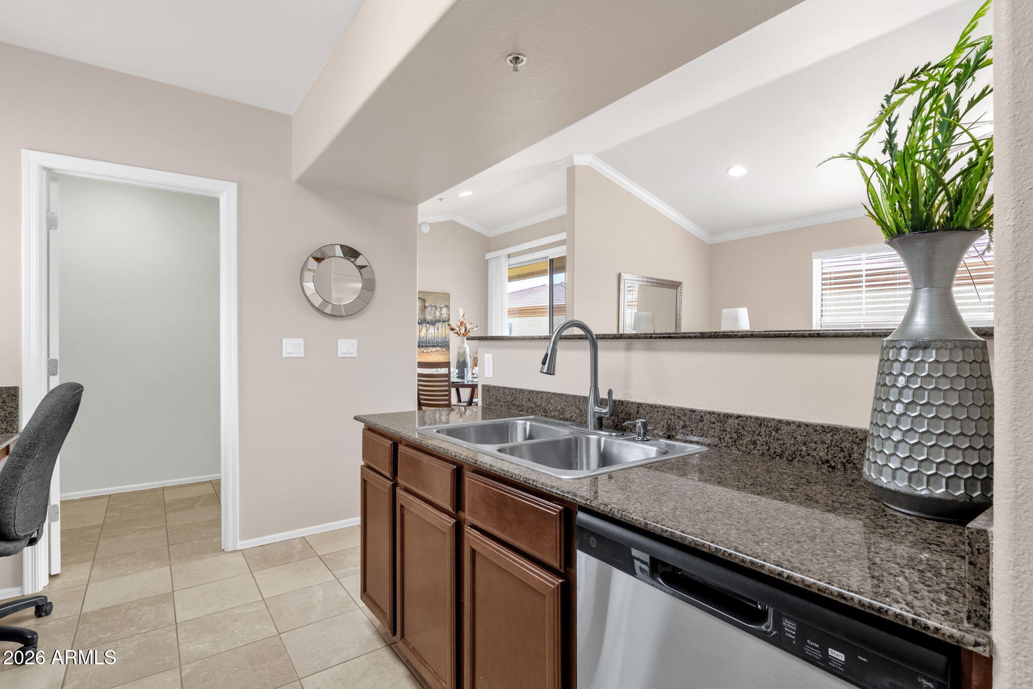 2134 East Broadway Road, Unit 2010 Tempe, AZ 85282 - Photo 10 of 42 a kitchen with granite countertop a sink a plant and a window