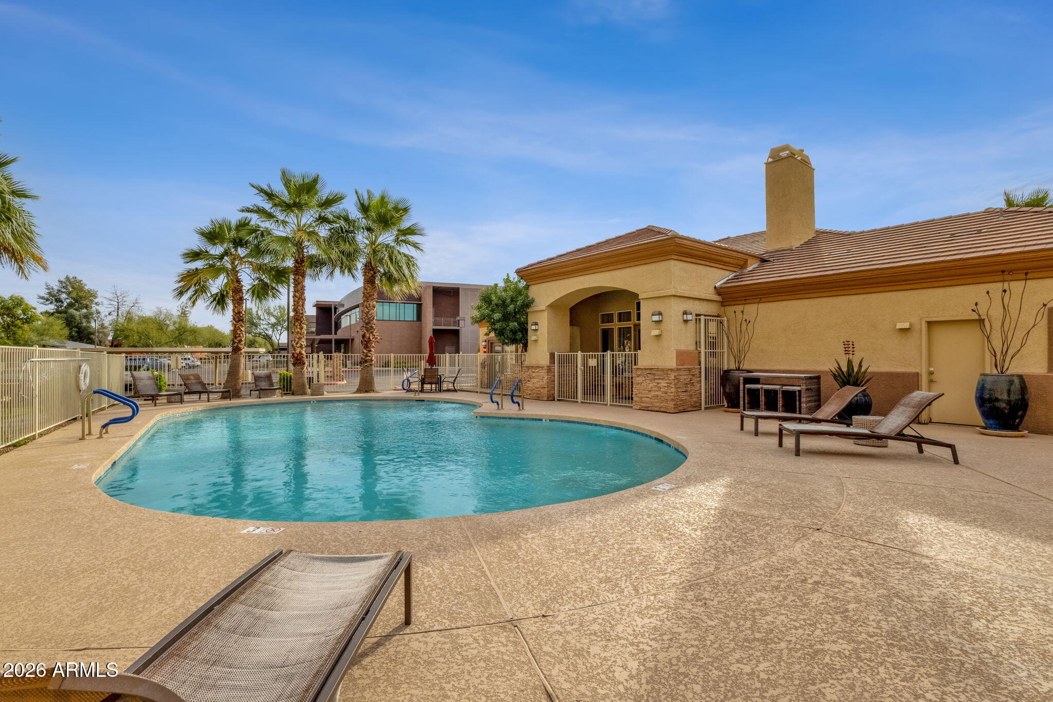 2134 East Broadway Road, Unit 2010 Tempe, AZ 85282 - Photo 31 of 42 a front view of a house with garden