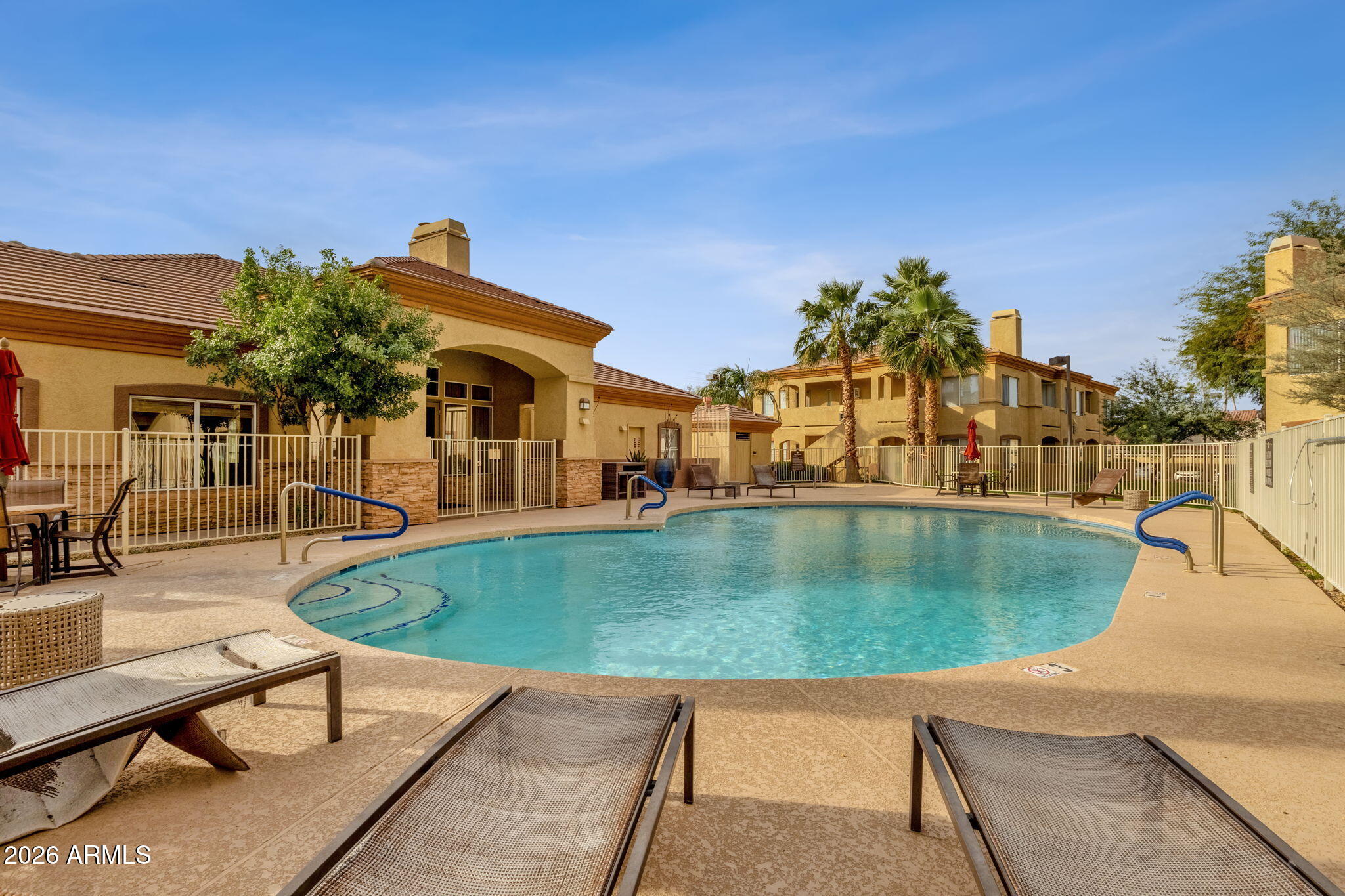 2134 East Broadway Road, Unit 2010 Tempe, AZ 85282 - Photo 32 of 42 a view of a swimming pool with a patio