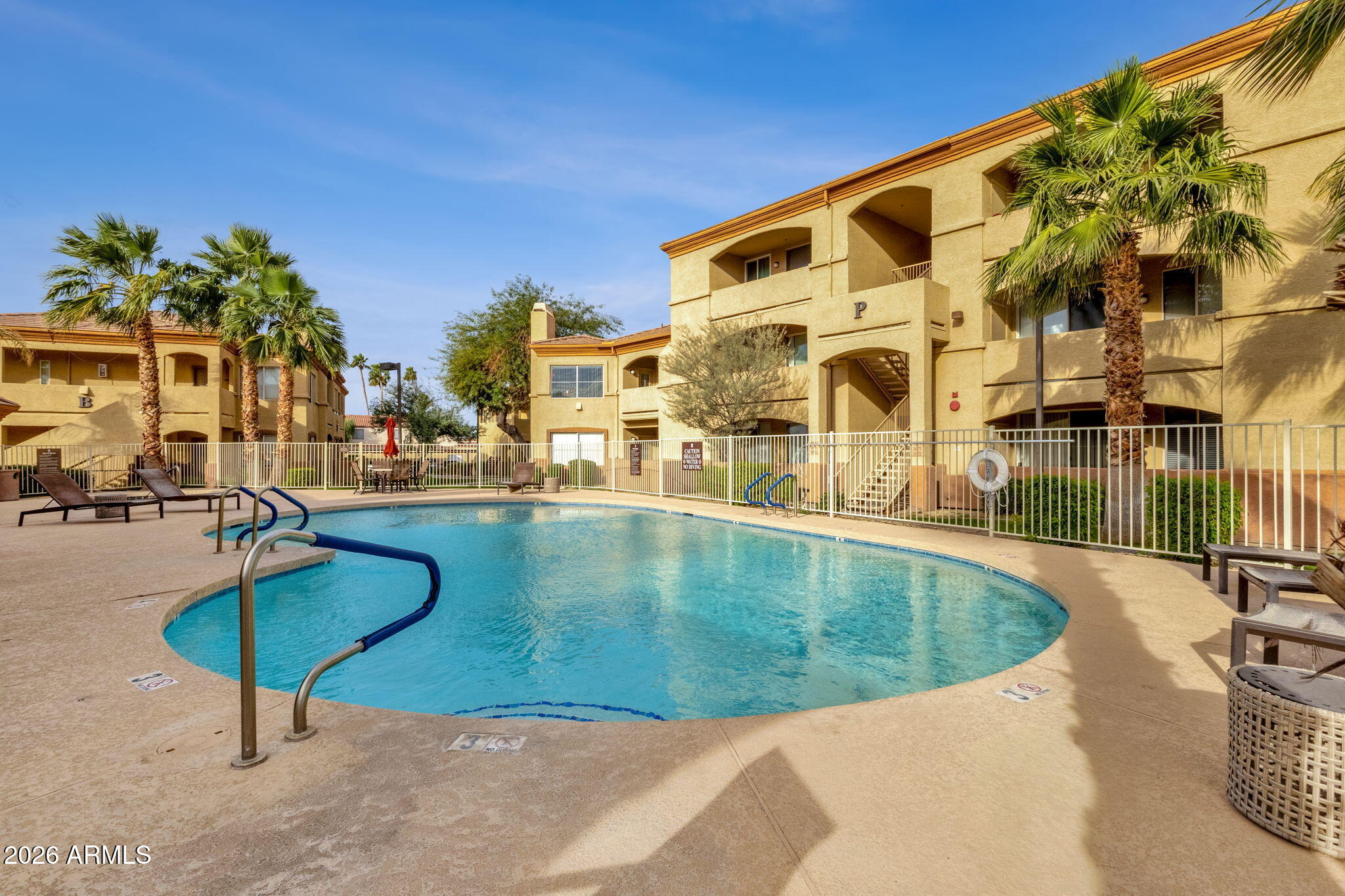 2134 East Broadway Road, Unit 2010 Tempe, AZ 85282 - Photo 33 of 42 a view of a swimming pool with a patio