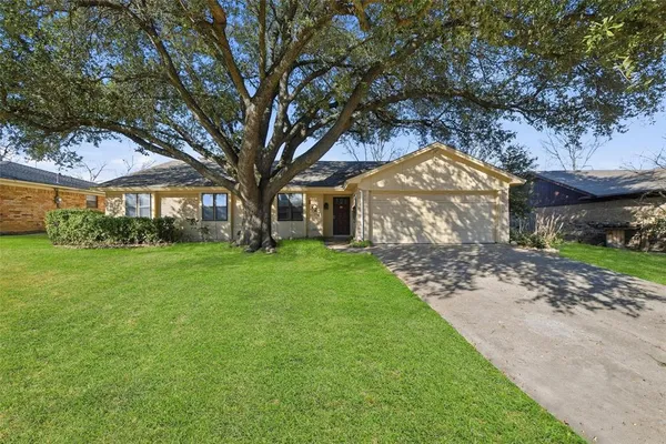 a view of house with yard