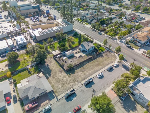 an aerial view of a residential houses with outdoor space