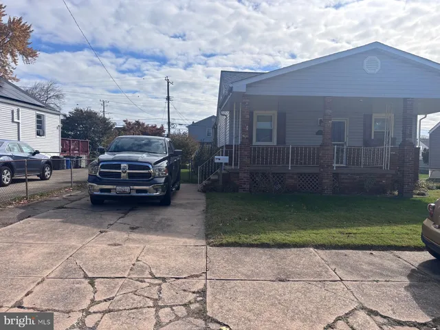 a view of a car parked in front of a house