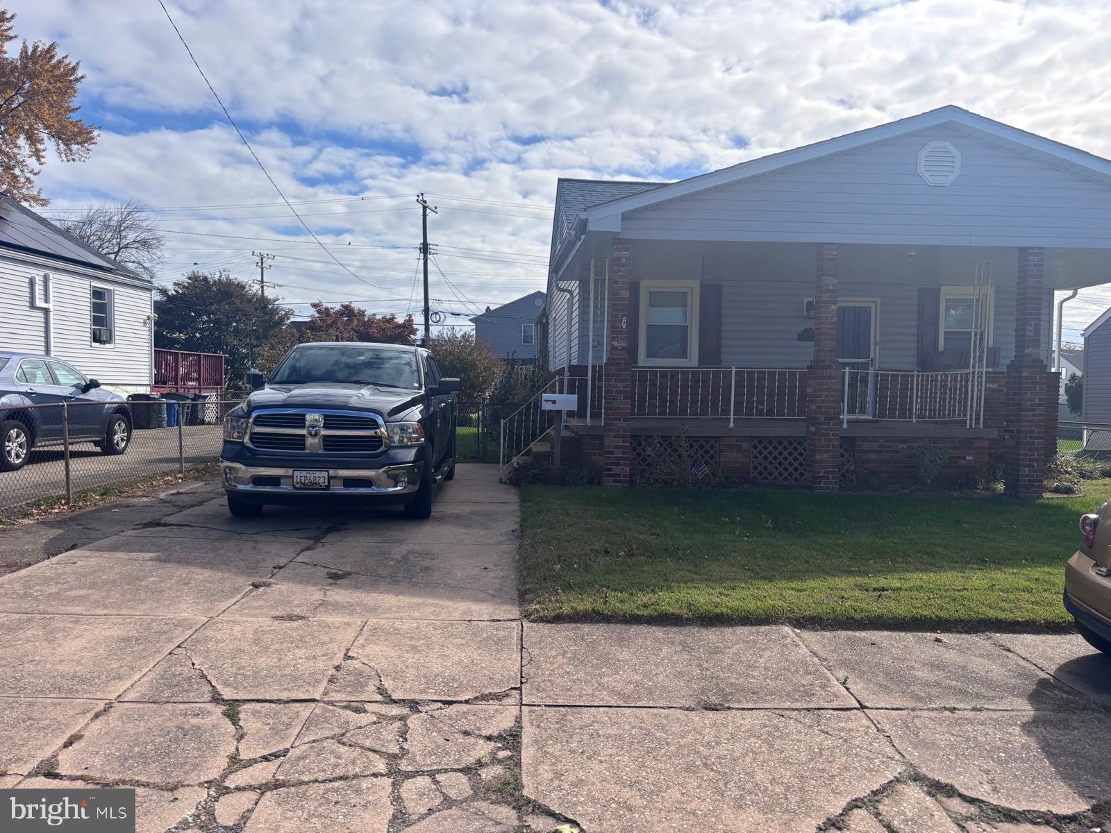 a view of a car parked in front of a house