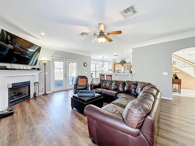 a kitchen with stainless steel appliances granite countertop a stove a sink dishwasher and a microwave oven with cabinets