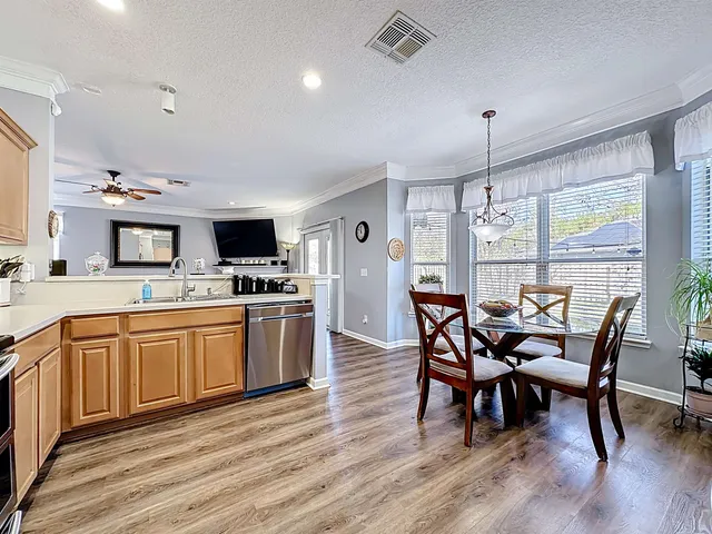 a room with furniture and pool table