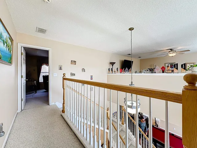 a bedroom with a bed and a tv