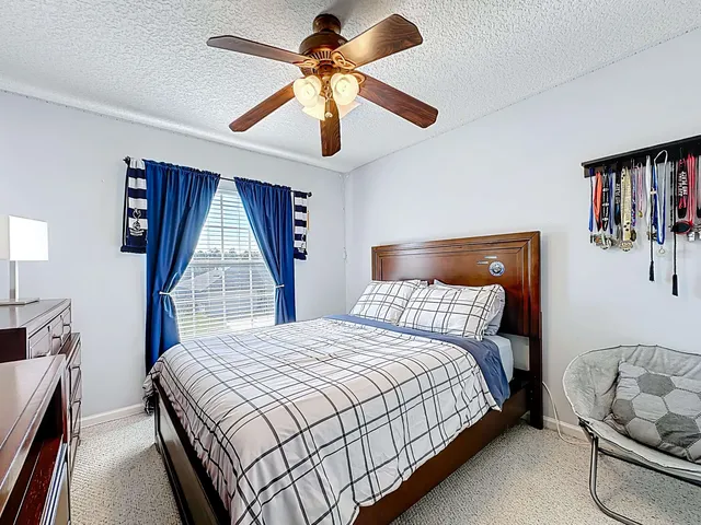 an aerial view of a house with a lake view