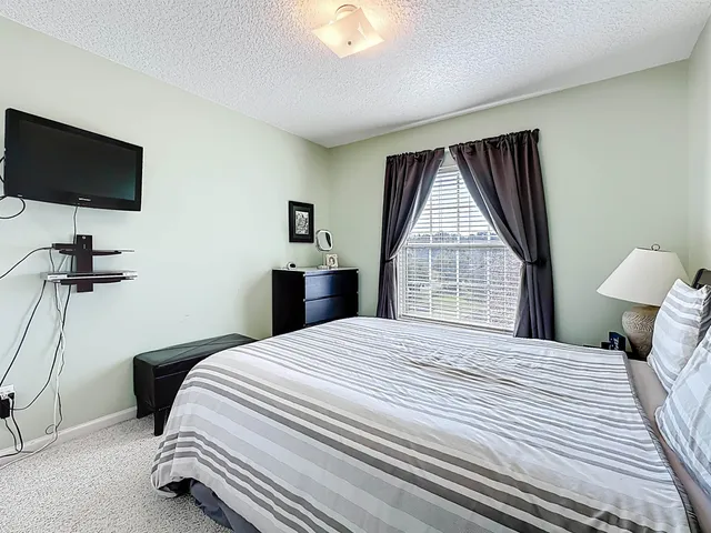 swimming pool view with a seating space