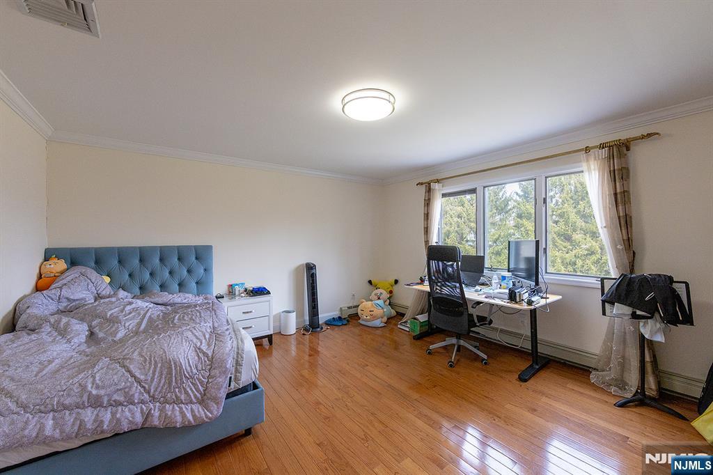 81 Crescent Avenue Mahwah, NJ 07430 - Photo 14 of 25 a bedroom with furniture and a large window