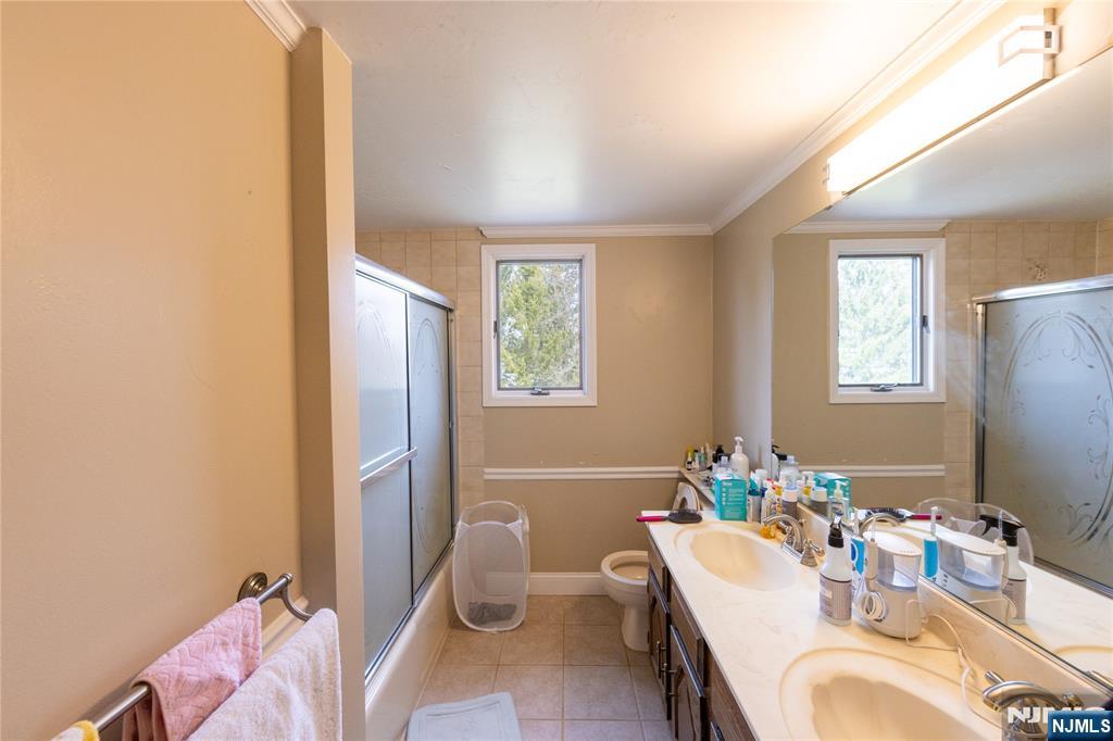 81 Crescent Avenue Mahwah, NJ 07430 - Photo 15 of 25 a bathroom with a sink mirror vanity and toilet