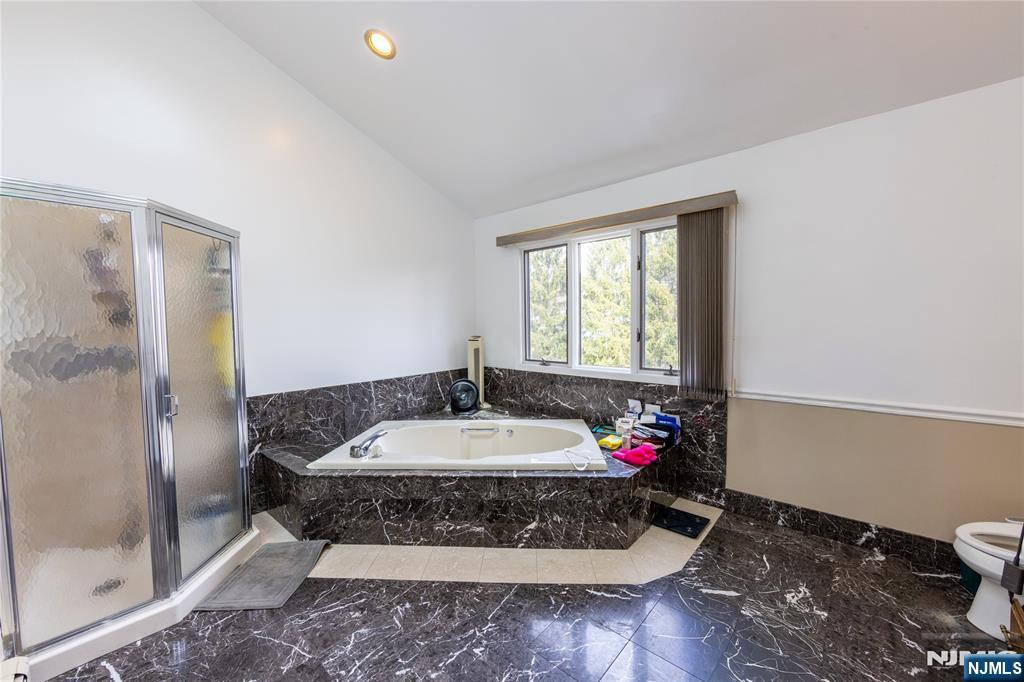 81 Crescent Avenue Mahwah, NJ 07430 - Photo 17 of 25 a bathroom with a sink and a mirror