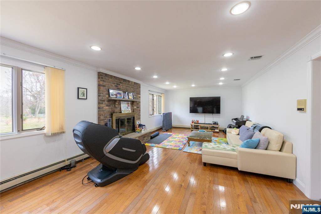 81 Crescent Avenue Mahwah, NJ 07430 - Photo 5 of 25 a living room with furniture and a flat screen tv