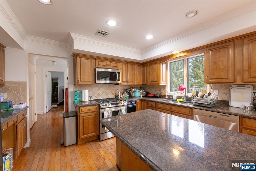 81 Crescent Avenue Mahwah, NJ 07430 - Photo 7 of 25 a kitchen with lots of counter top space and stainless steel appliances