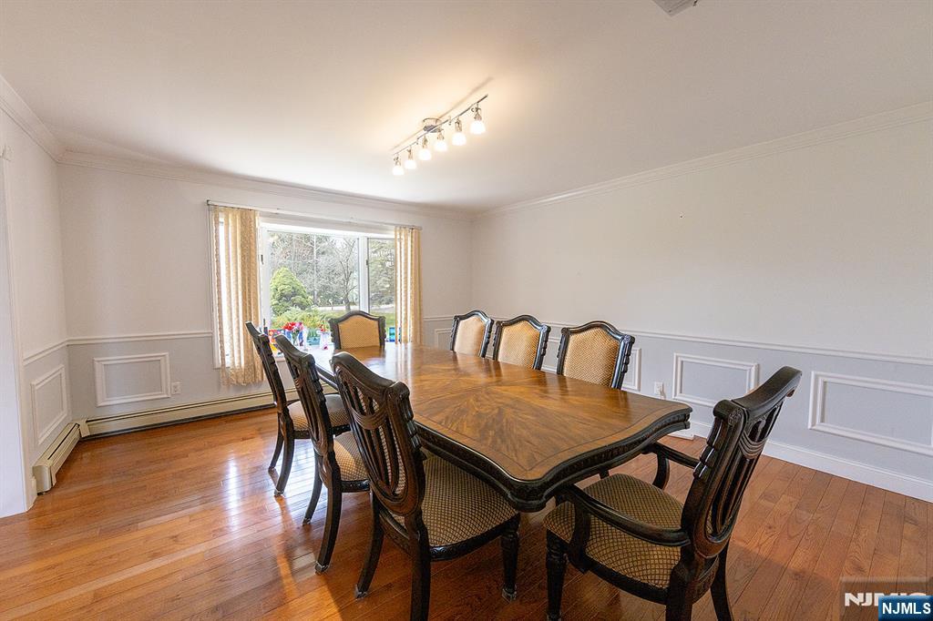 81 Crescent Avenue Mahwah, NJ 07430 - Photo 8 of 25 a view of a dining room with furniture and wooden floor