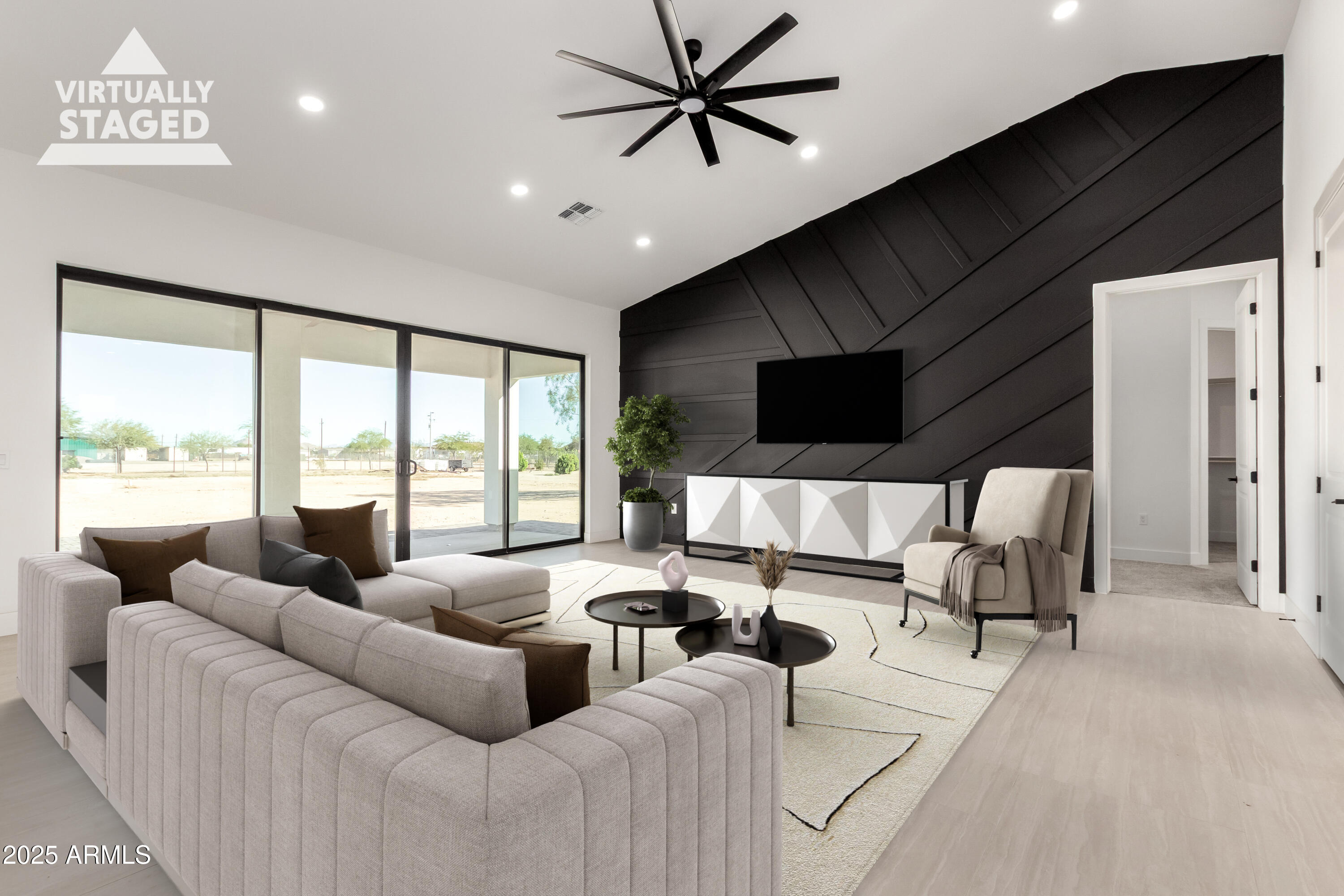 681 North Bruner Road Buckeye, AZ 85396 - Photo 12 of 60 a living room with furniture tv and a large window