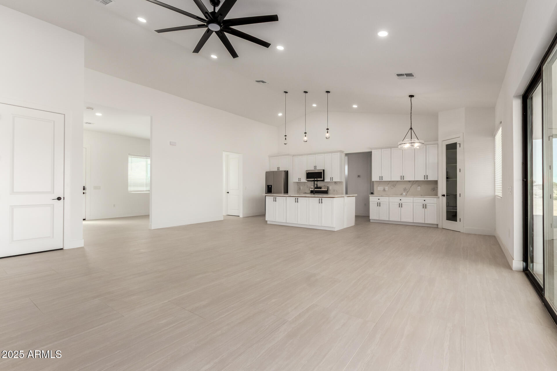 681 North Bruner Road Buckeye, AZ 85396 - Photo 13 of 60 a view of a kitchen with a sink and cabinet area