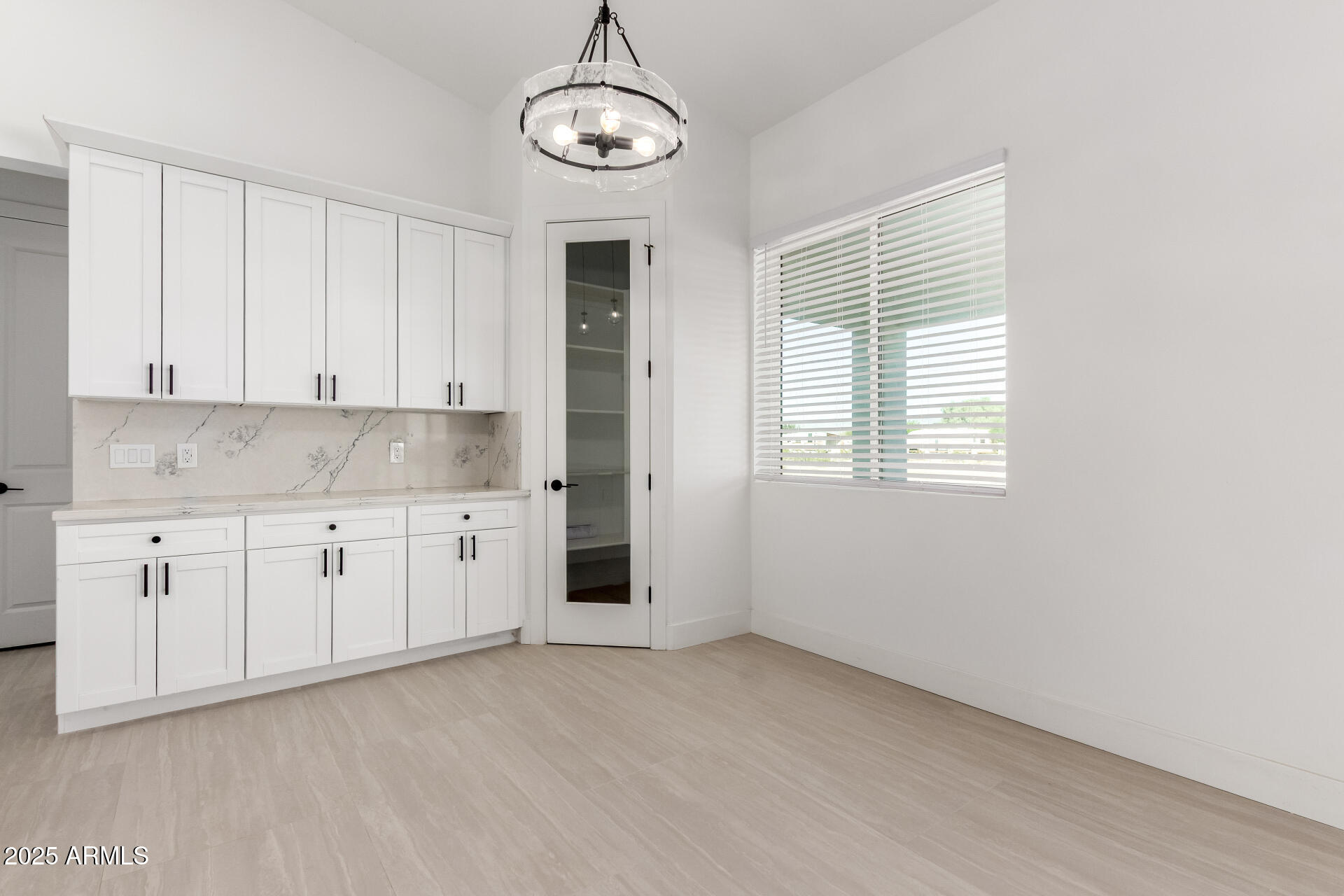 681 North Bruner Road Buckeye, AZ 85396 - Photo 15 of 60 a view of a kitchen with granite countertop cabinets and window