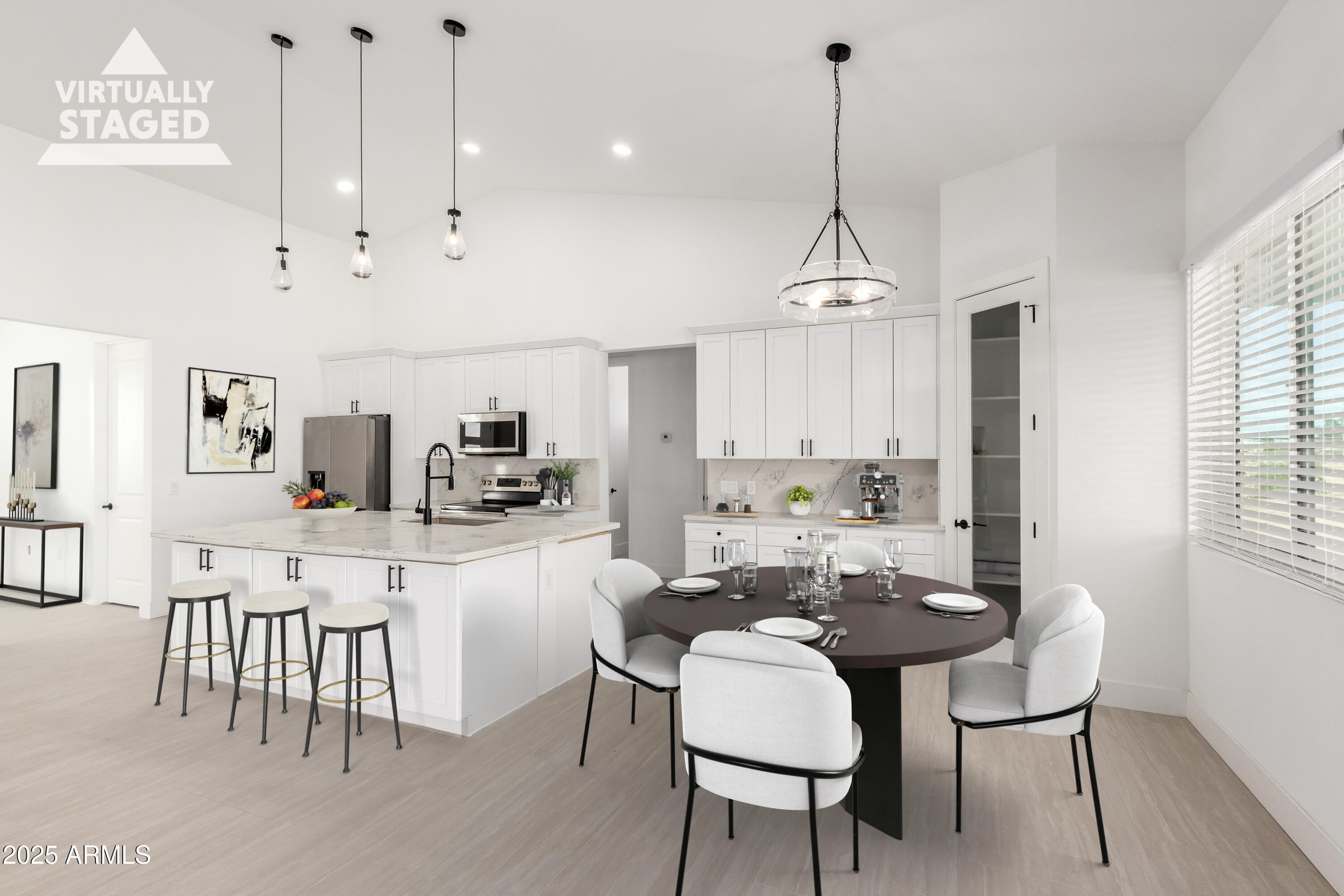 681 North Bruner Road Buckeye, AZ 85396 - Photo 17 of 60 a kitchen with kitchen island a dining table chairs a sink and a window