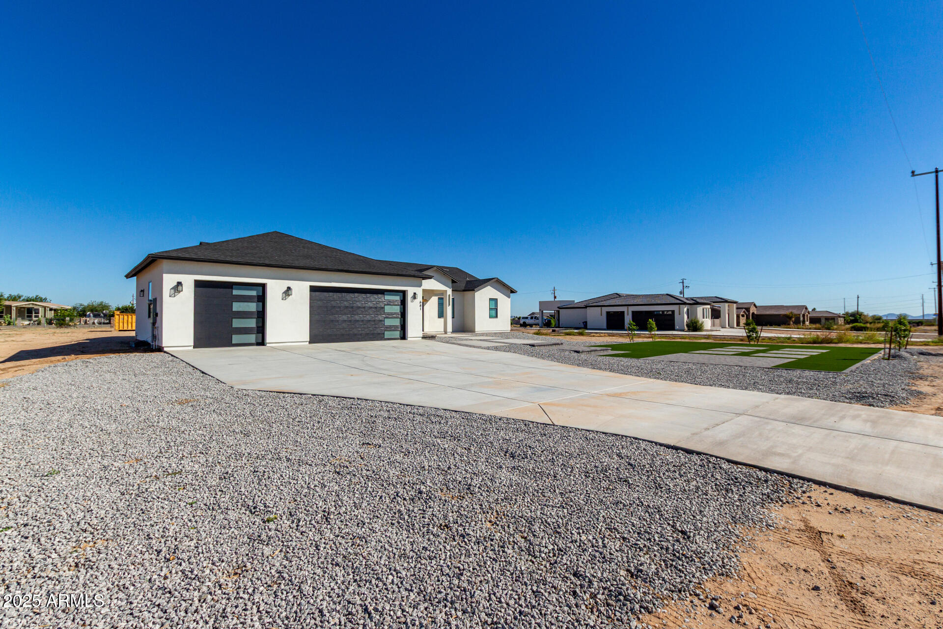 681 North Bruner Road Buckeye, AZ 85396 - Photo 2 of 60 a front view of a house with a yard