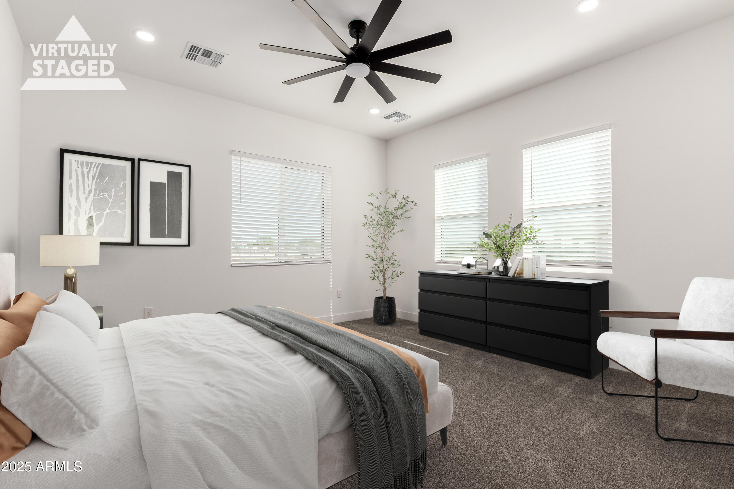 681 North Bruner Road Buckeye, AZ 85396 - Photo 22 of 60 a bed room with a bed and a dresser