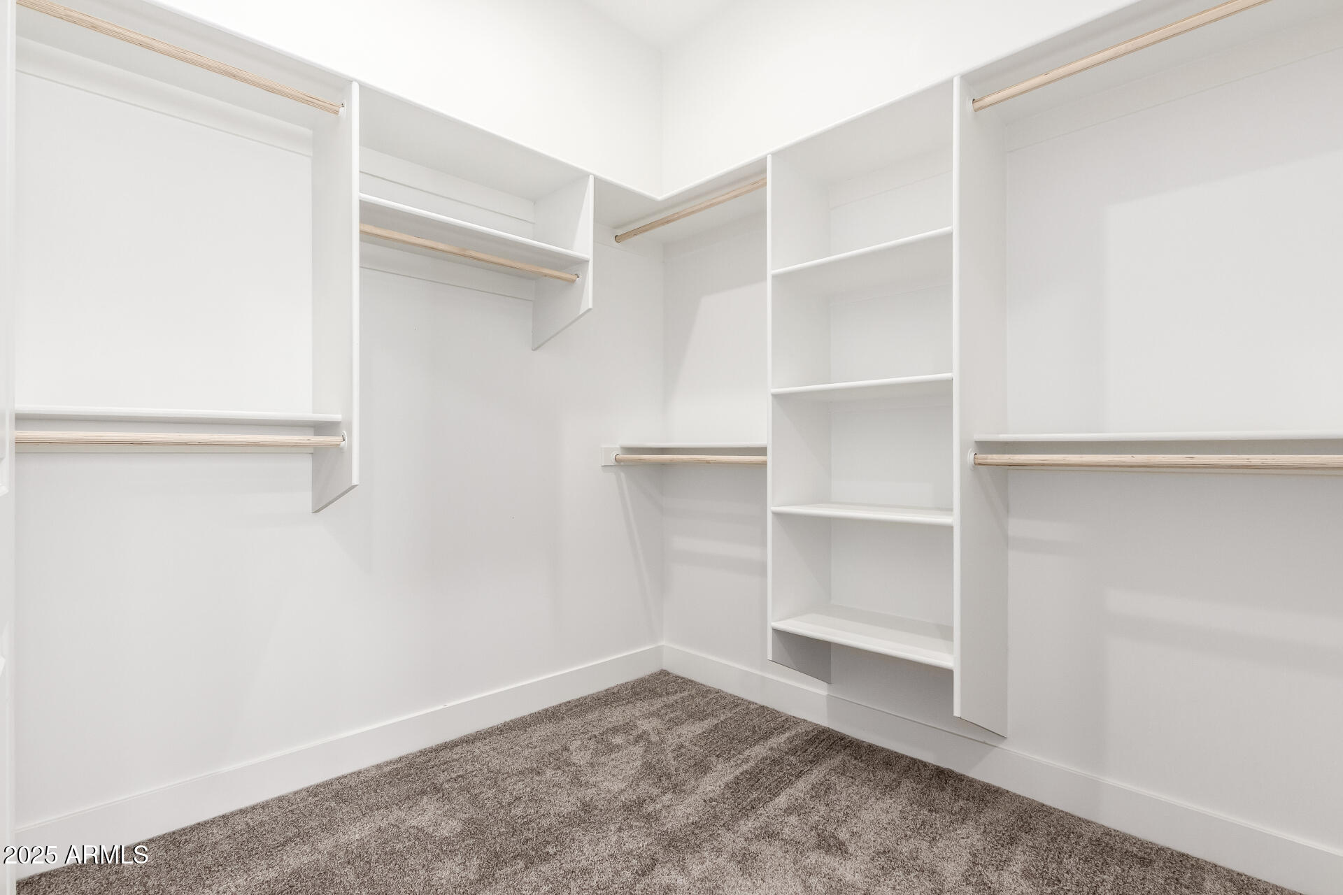 681 North Bruner Road Buckeye, AZ 85396 - Photo 27 of 60 a view of an empty walk in closet