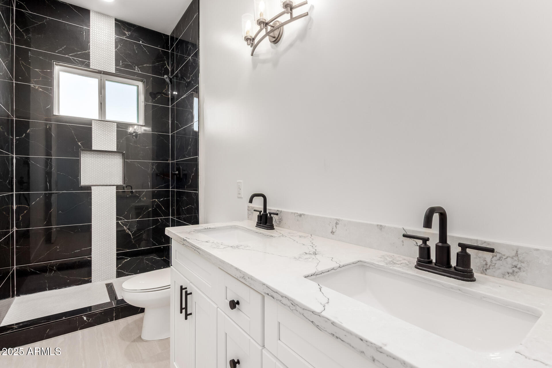 681 North Bruner Road Buckeye, AZ 85396 - Photo 34 of 60 a bathroom with a sink and a mirror