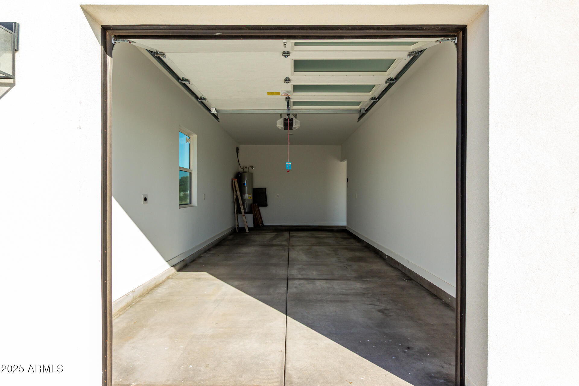 681 North Bruner Road Buckeye, AZ 85396 - Photo 36 of 60 a view of a hallway with wooden floor and a large window