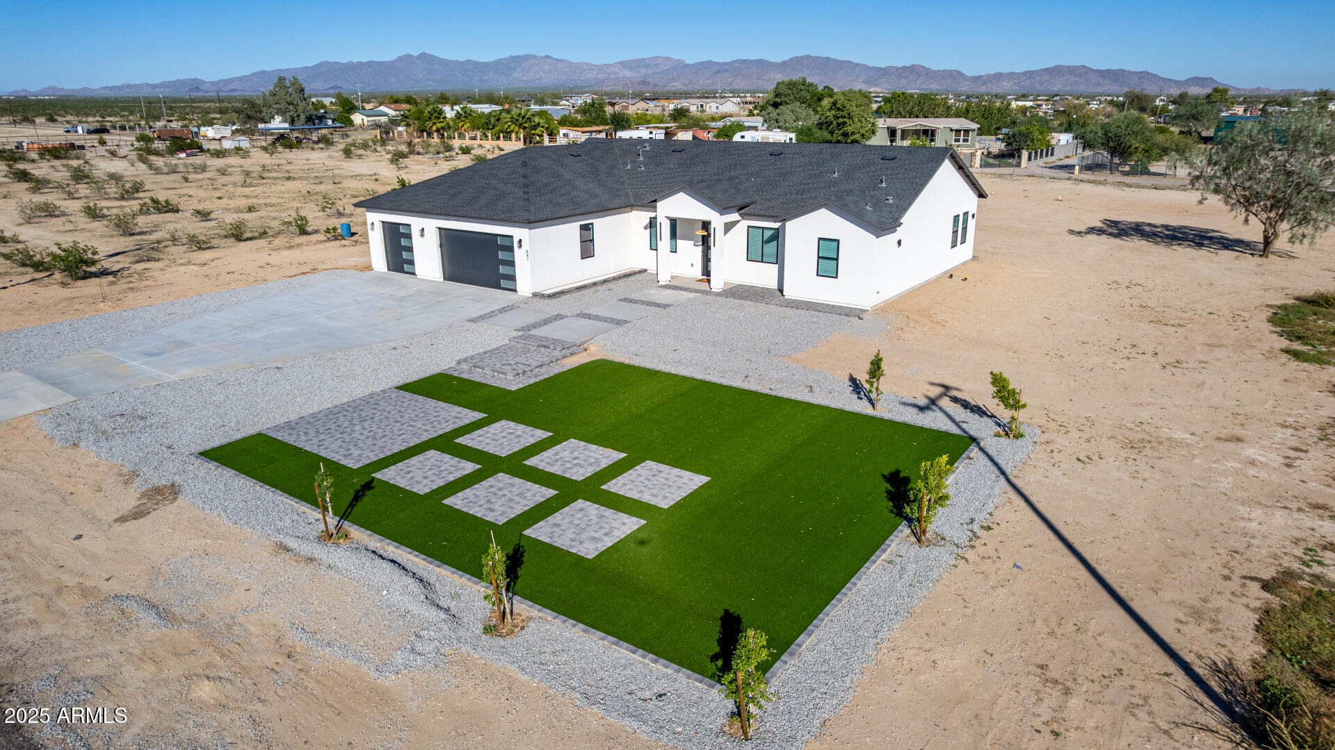 681 North Bruner Road Buckeye, AZ 85396 - Photo 51 of 60 a view of a house with a yard