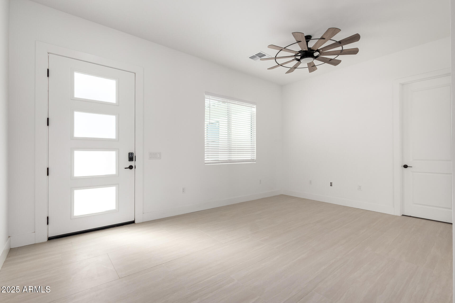 681 North Bruner Road Buckeye, AZ 85396 - Photo 8 of 60 a view of an empty room and a window