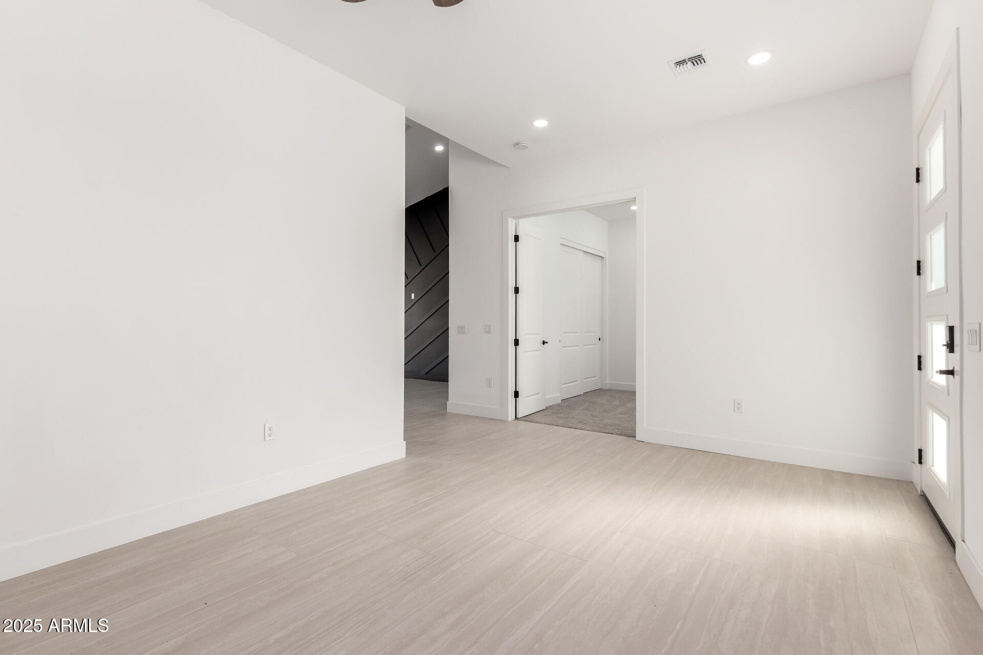 681 North Bruner Road Buckeye, AZ 85396 - Photo 9 of 60 an empty room with wooden floor