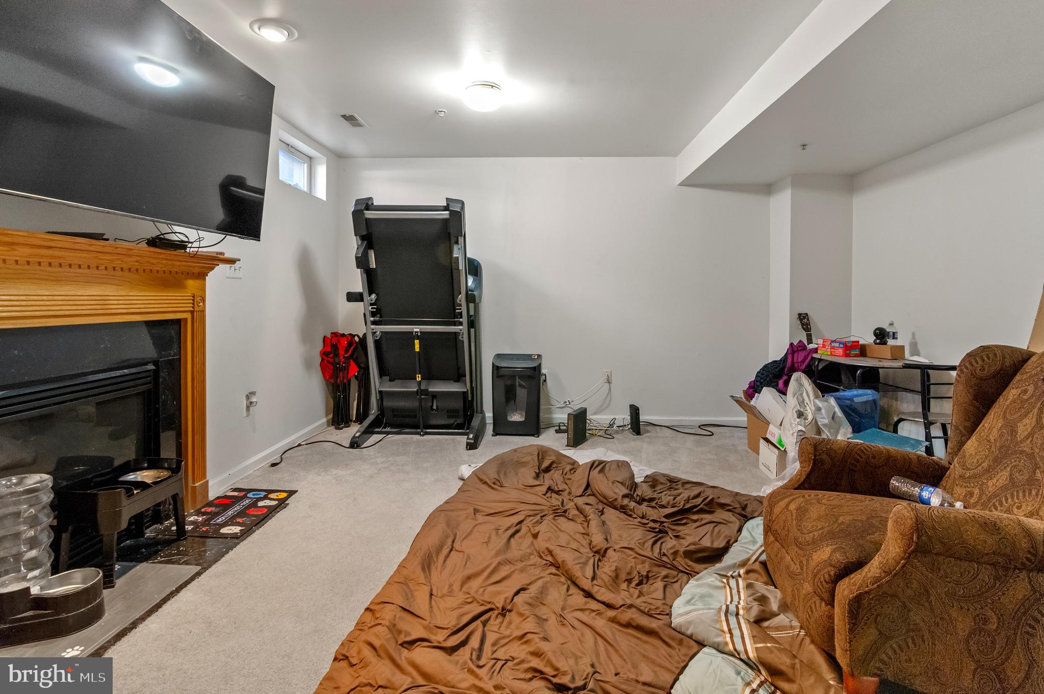 7106 Firebrush Court Clinton, MD 20735 - Photo 25 of 28 Fully Finished Lower Level with Gas Fireplace