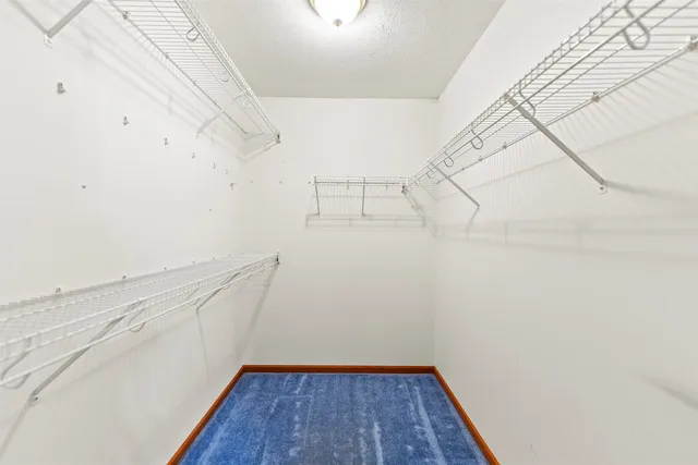 a view of a room with racks on the wall