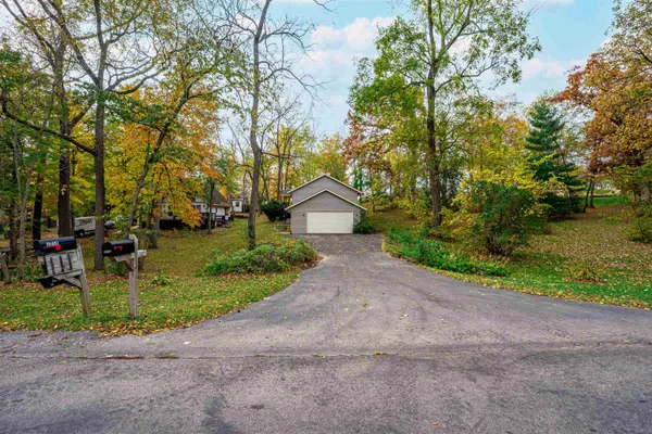 a view of garage and yard
