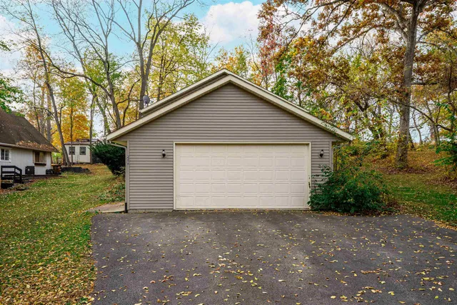 a view of garage and yard