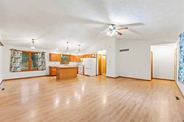 a view of a kitchen with microwave and a sink