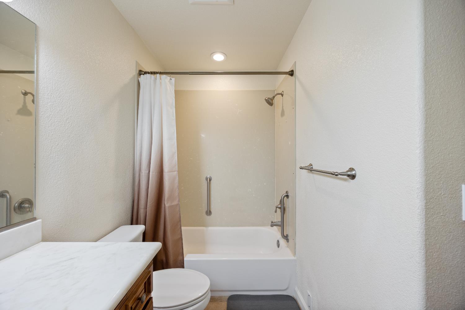 8009 Spring Valley Road Pollock Pines, CA 95726 - Photo 16 of 31 a bathroom with a sink toilet and shower