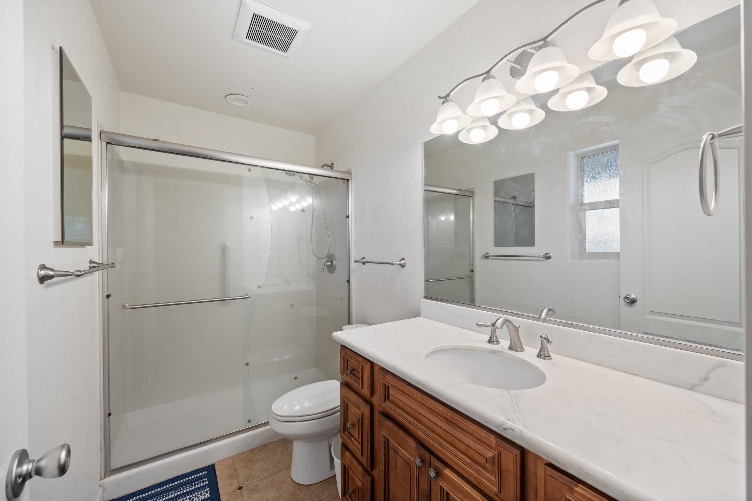 8009 Spring Valley Road Pollock Pines, CA 95726 - Photo 21 of 31 a bathroom with a sink a toilet and shower