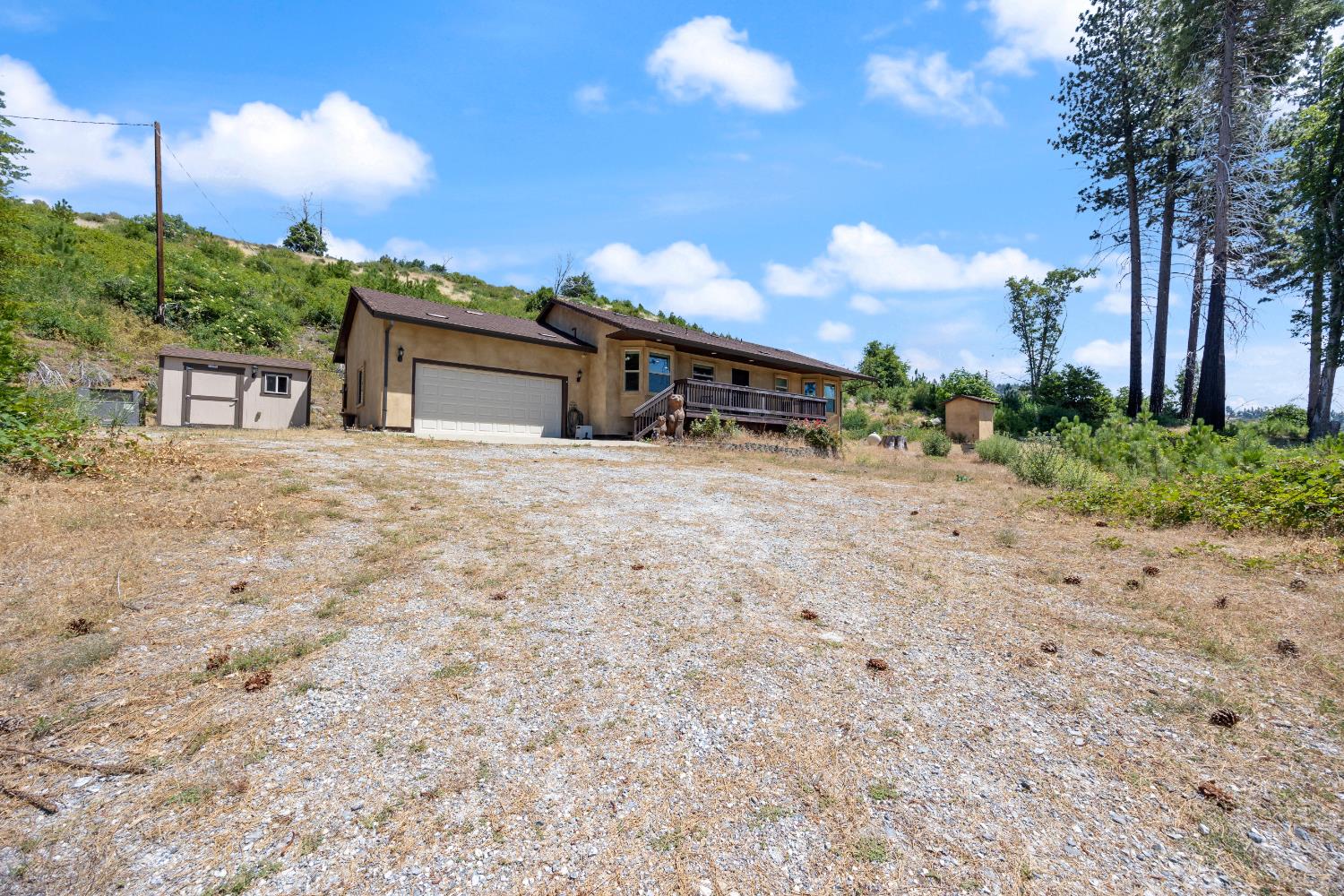8009 Spring Valley Road Pollock Pines, CA 95726 - Photo 24 of 31 a house with yard in front of it