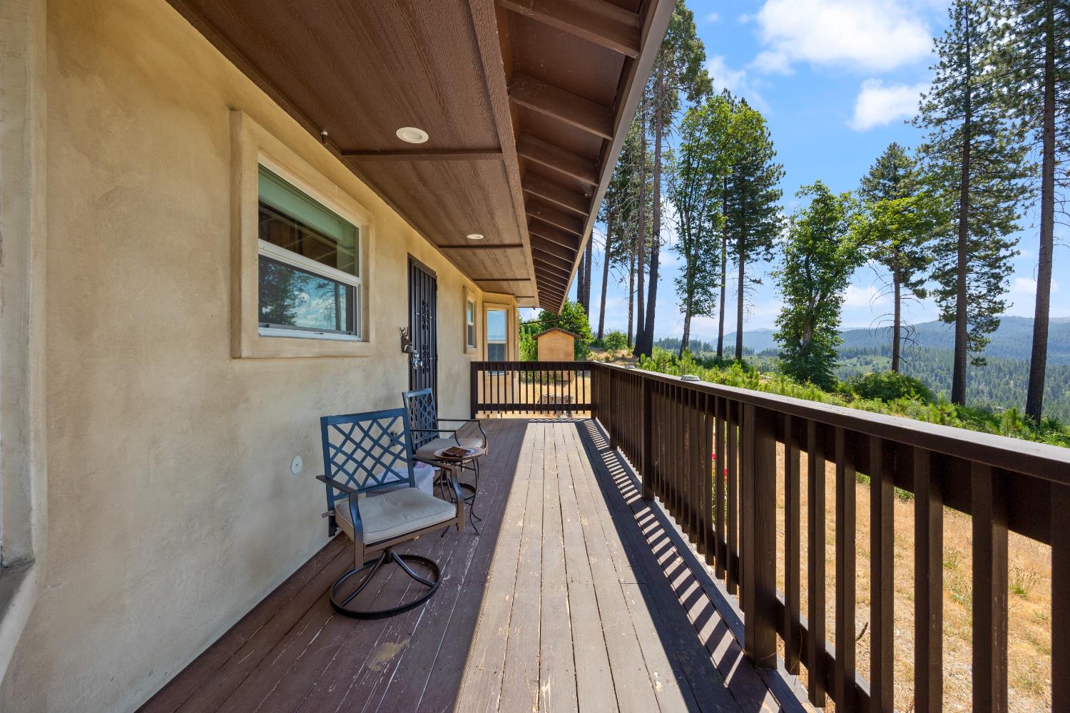 8009 Spring Valley Road Pollock Pines, CA 95726 - Photo 3 of 31 a view of balcony with wooden floor and outdoor seating