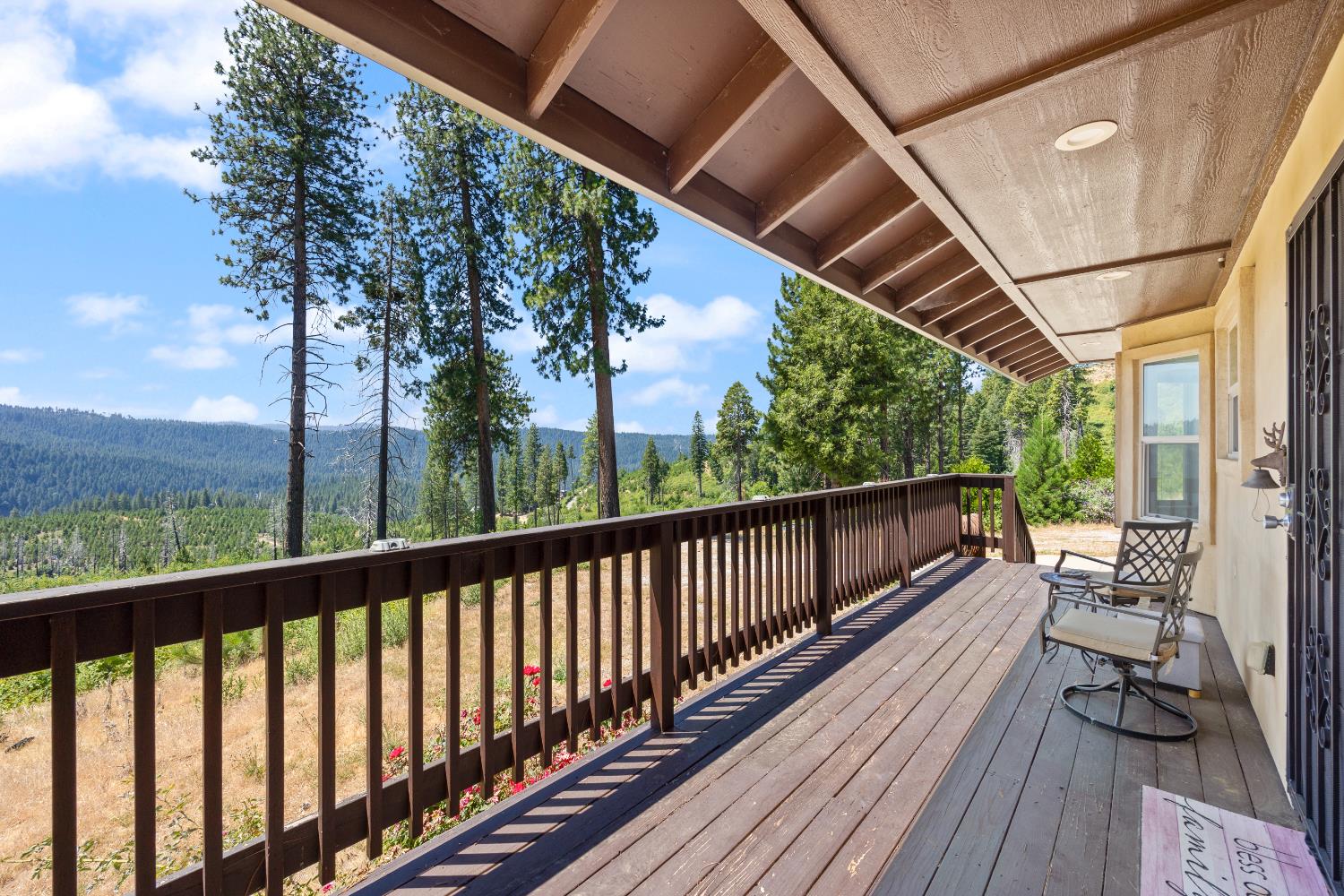 8009 Spring Valley Road Pollock Pines, CA 95726 - Photo 5 of 31 a view of balcony with couch and wooden floor