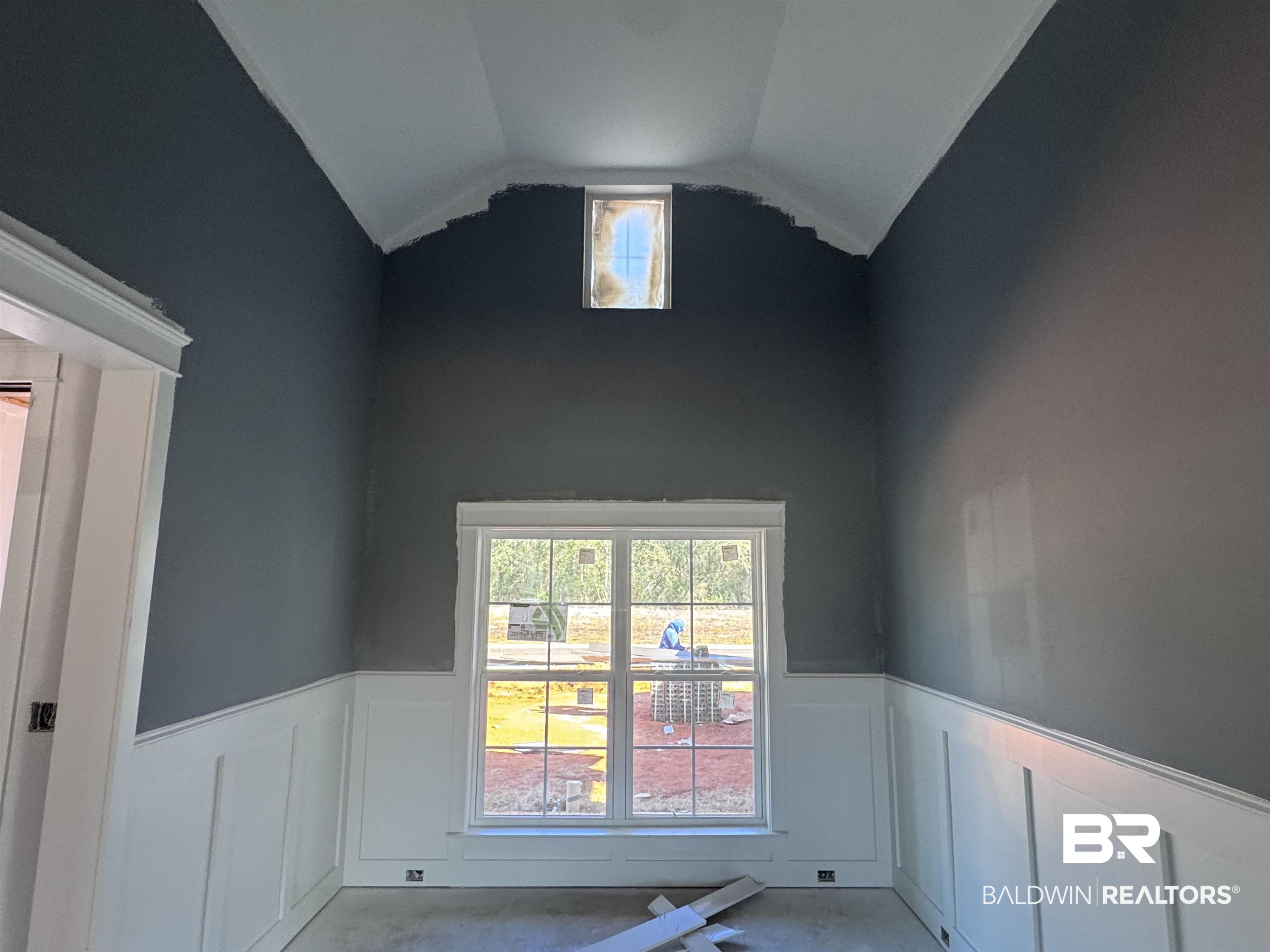 27371 Patch Pl Loop Daphne, AL 36526 - Photo 4 of 63 Unfurnished room with wainscoting, vaulted ceiling, and a decorative wall