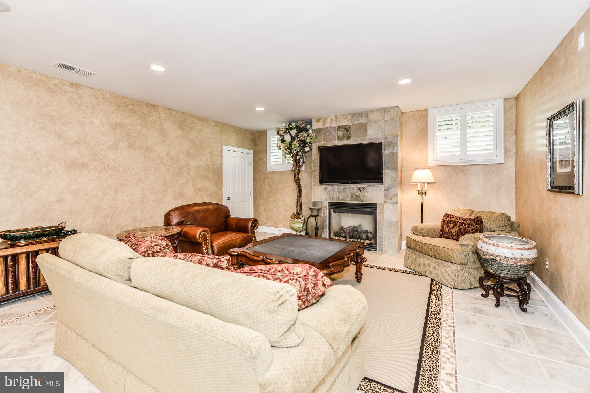 306 Ayito Road Southeast Vienna, VA 22180 - Photo 64 of 82 Lower level family room with fireplace