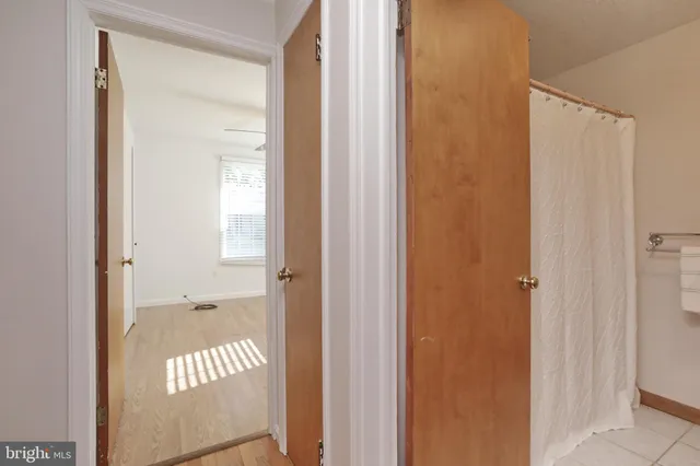 a view of a bathroom from a hallway