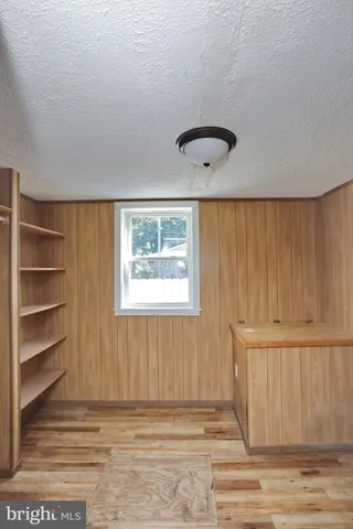 a bathroom with a tub shower and sink