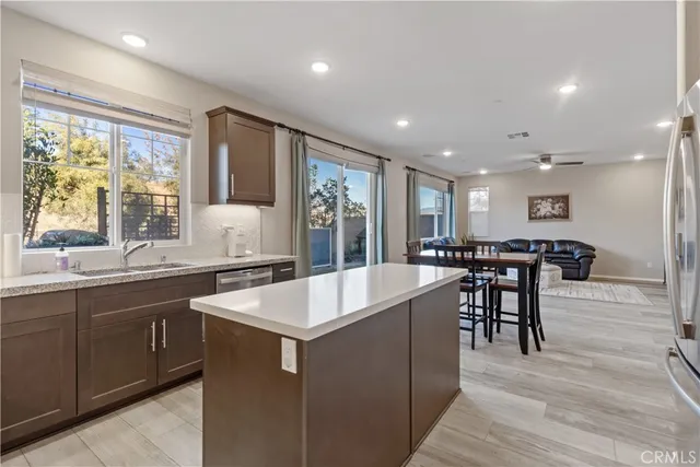 a large white kitchen with a large window